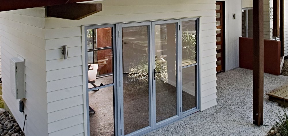 Essential open out hinged door with Essential double hung sidelites (screen doors not available for open out doors)